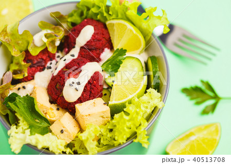 Vegan buddha bowl with beetroot meatballs Vegan buddha bowl with beetroot meatballs 40513708