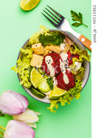 Vegan buddha bowl with beetroot meatballs Vegan buddha bowl with beetroot meatballs 40513962
