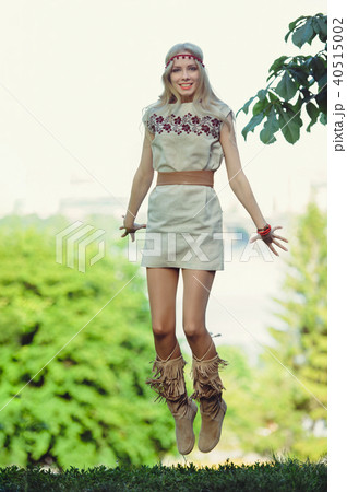 tender blonde woman jumping looks into tender blonde woman jumping looks into 40515002