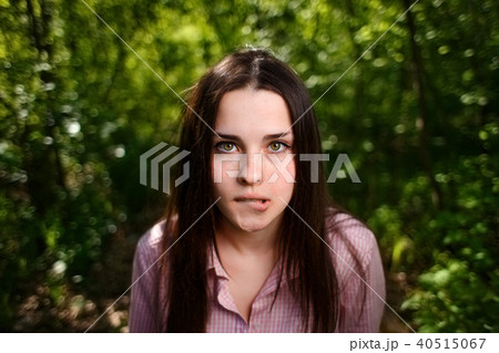 Portrait of attractive young indecisive shy woman face close up Portrait of attractive young indecisive shy woman face close up 40515067