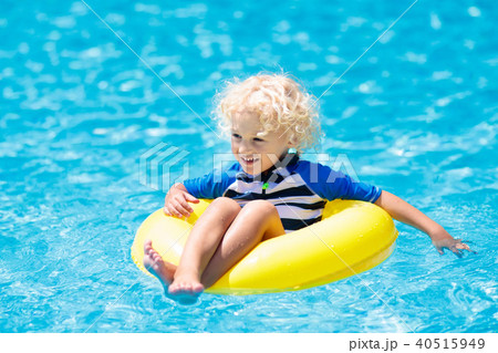Child in swimming pool. Kids swim. Water play. Child in swimming pool. Kids swim. Water play. 40515949
