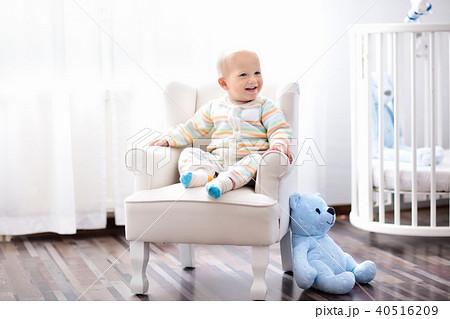 Baby boy in bedroom. Kids room. Bed for child. 40516209