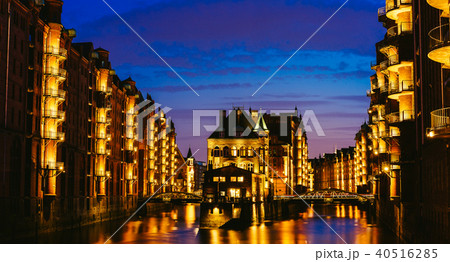 The Warehouse District - Speicherstadt in twilight. Tourism landmark of Hamburg. View of The Warehouse District - Speicherstadt in twilight. Tourism landmark of Hamburg. View of 40516285