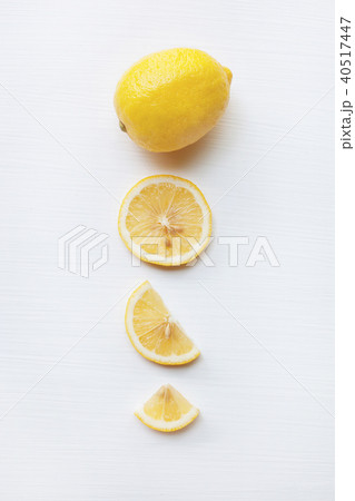Fresh lemon with slices on white. Fresh lemon with slices on white. 40517447