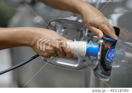 Charging an electric car with power cable supply Charging an electric car with power cable supply 40518560