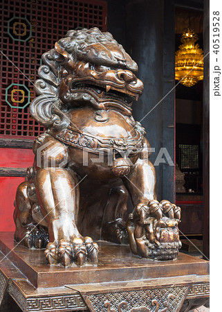 Lion bronze statue in front of a buddhist temple Lion bronze statue in front of a buddhist temple 40519528