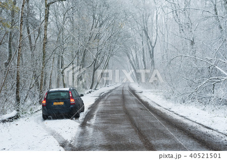 car parked in the border of a road in the forest car parked in the border of a road in the forest 40521501