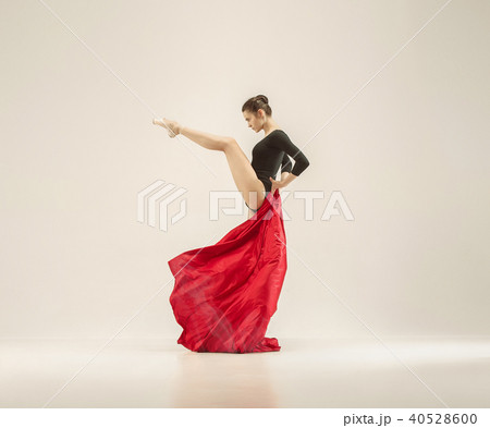 Modern ballet dancer dancing in full body on white studio background. 40528600