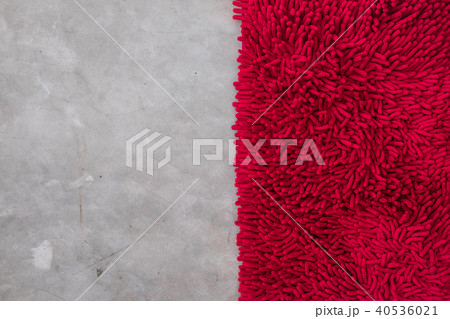 Gray concrete floor with red rug fluffy carpet Gray concrete floor with red rug fluffy carpet 40536021