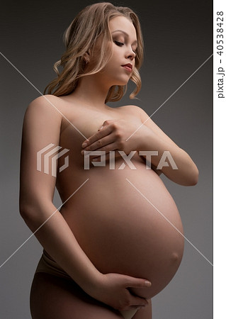 young pregnant nude Adobe Stock