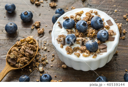 Yogurt with Fresh Blueberries on Woden Table 40539144