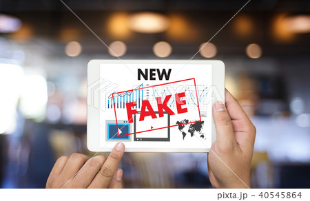 Fake news concept man reading news media  Fake news concept man reading news media  40545864
