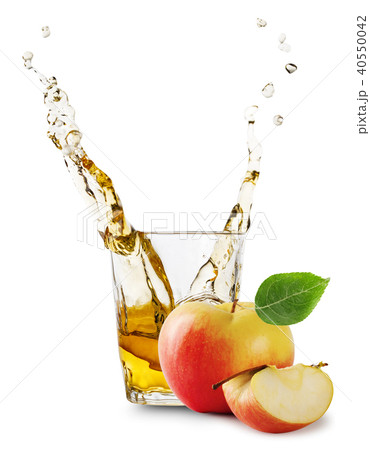 Glass of apple juice with splash and apples Glass of apple juice with splash and apples 40550042
