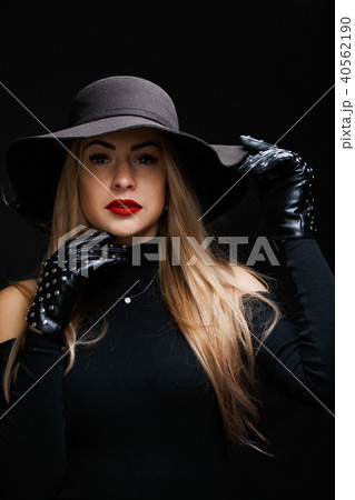 Photo of young blonde in hat , gloves 40562190