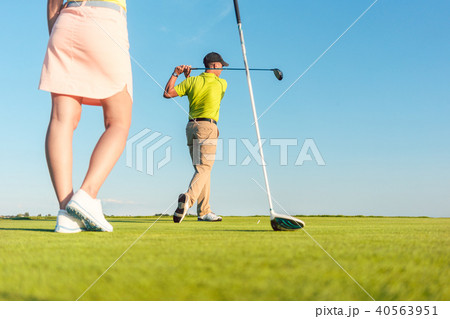 Man playing professional golf with his partner during matchplay Man playing professional golf with his partner during matchplay 40563951