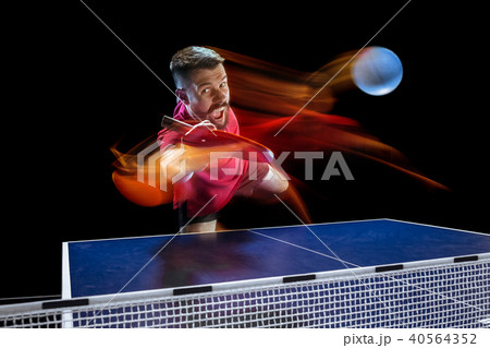 The table tennis player serving 40564352