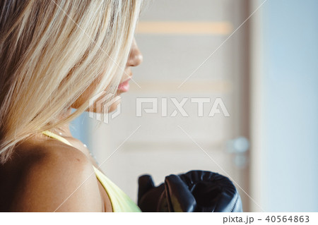 girl boxer standing near a pear girl boxer standing near a pear 40564863