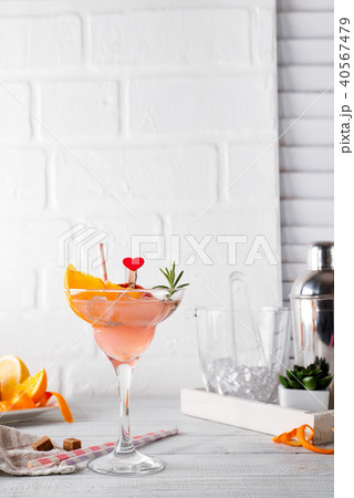 Frozen Margarita or Daiquiry Cocktail with rosemary, fresh orange and grapefruit juice 40567479