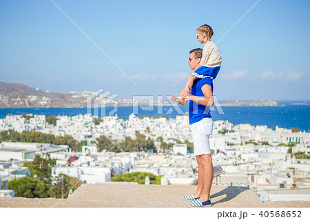 Happy father and little adorable girl in Mykonos during summer greek vacation 40568652