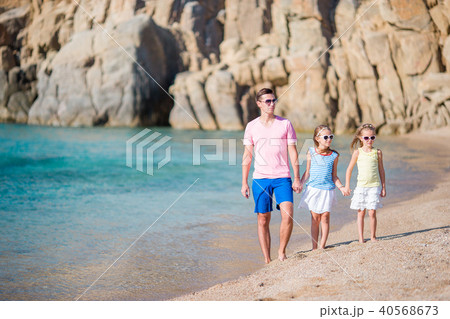 Family of dad and kids on white sandy beach Family of dad and kids on white sandy beach 40568673