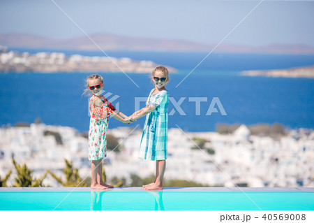 Beautiful girls enjoy greek vacation on Little Venice background. Beautiful girls enjoy greek vacation on Little Venice background. 40569008
