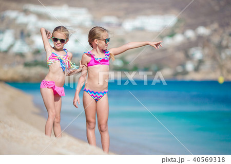 Two little girls together on the beach on vacation 40569318