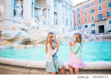 Adorable little girls on the edge of Fountain of Trevi in Rome. Adorable little girls on the edge of Fountain of Trevi in Rome. 40569351