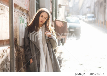 Woman walking in the old town. 40578203