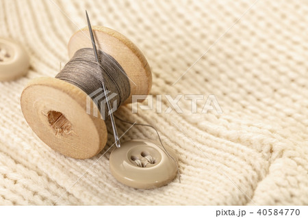 spool of thread with a needle spool of thread with a needle 40584770