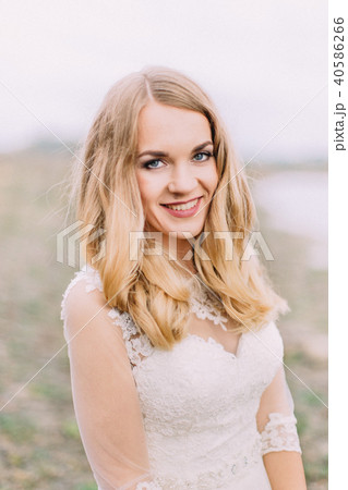 Portrait of the smiling blonde bride. 40586266