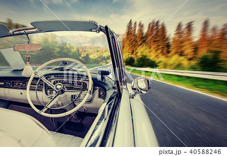 Fantastic asphalt road in the mountains. Classic car 40588246