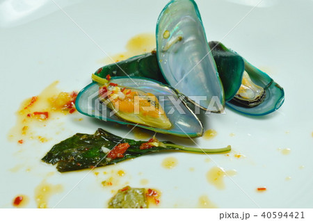 steamed mussel dressing with spicy sauce on plate steamed mussel dressing with spicy sauce on plate 40594421