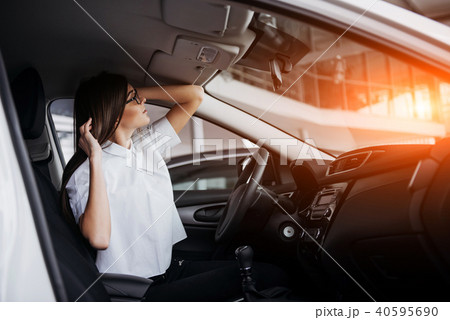 portrait of young beautiful woman sitting in the car 40595690