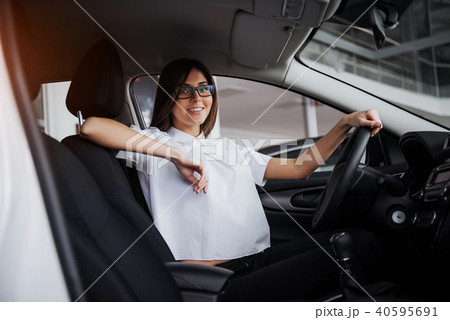 portrait of young beautiful woman sitting in the car 40595691