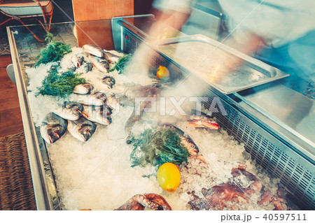 Fresh fish, octopuses in the refrigerated counter. 40597511