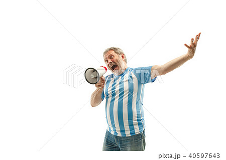 The Argentinean soccer fan celebrating on white background The Argentinean soccer fan celebrating on white background 40597643