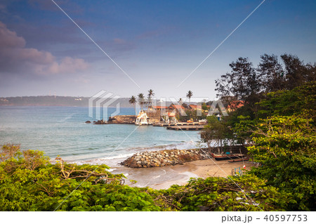 Unawatuna houses located next to the bay. 40597753