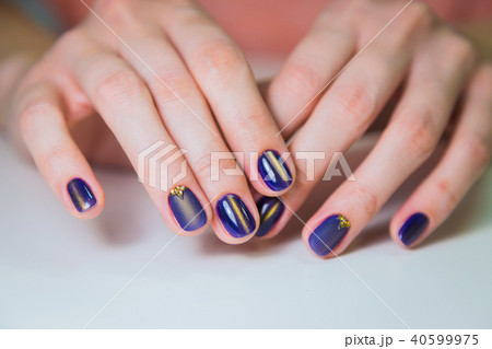 Finished purple shellac manicure, woman in nail beauty salon. Finished purple shellac manicure, woman in nail beauty salon. 40599975
