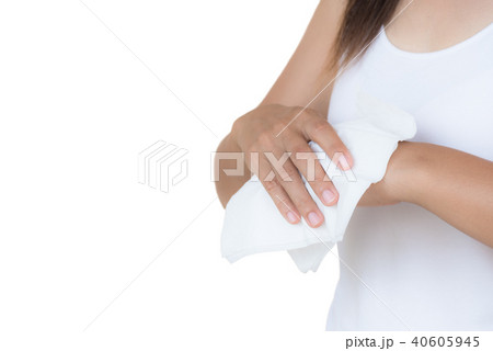 Woman cleaning her hands with a tissue. 40605945