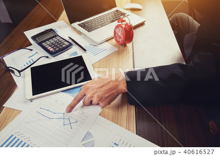 business man documents on office table with laptop 40616527