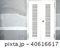 Locked white entrance door on painted cement wall 40616617
