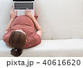 Pregnant woman searching news and online shopping 40616620