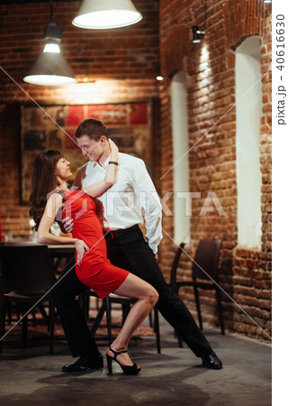 Dancing young couple on a white background. Passionate salsa dan 40616630