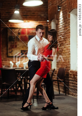 Dancing young couple on a white background. Passionate salsa dan 40616633