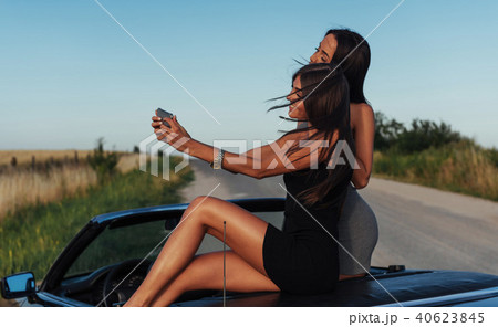 Beautiful two girls are photographed on the road 40623845