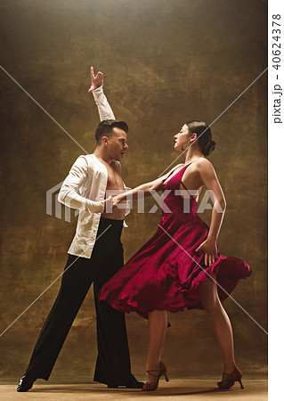 Dance ballroom couple in red dress dancing on...の写真素材