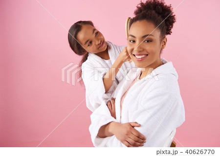 Little African American girl is combing mother 40626770