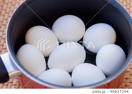 a few boiled eggs in a saucepan in the sun a few boiled eggs in a saucepan in the sun 40627294