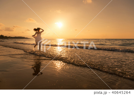 Pretty woman having fun and relax on beach.  40645264