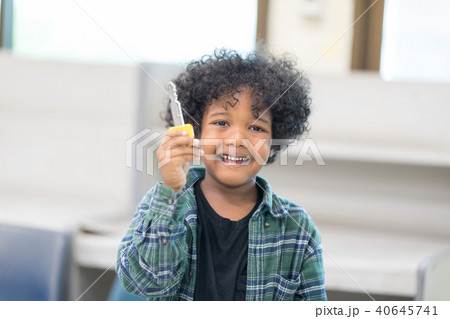 African ethnicity boy with Big Key in hands. 40645741